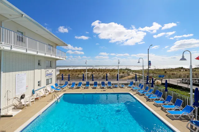 a view of a balcony with chairs