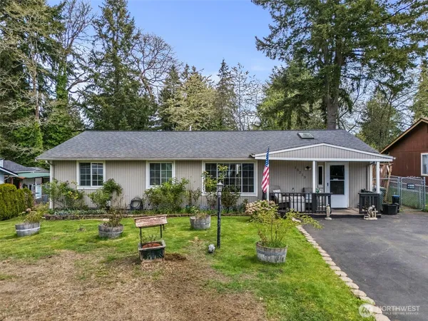 a view of a house with a yard porch and sitting area