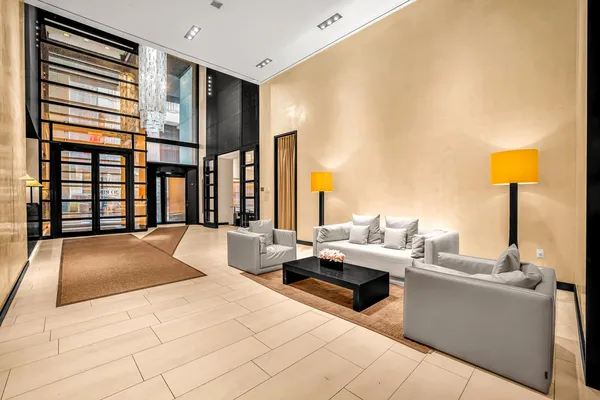a living room with furniture and large window