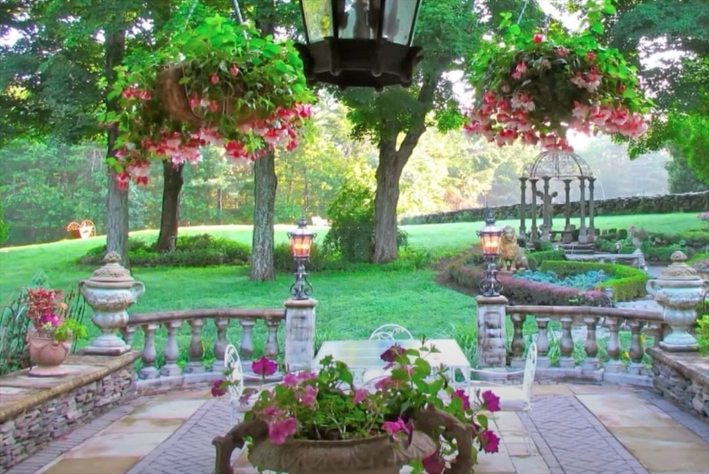 87 East Holland Road Fiskdale, MA 01518 - Photo 12 of 30 a view of a garden with flowers and trees