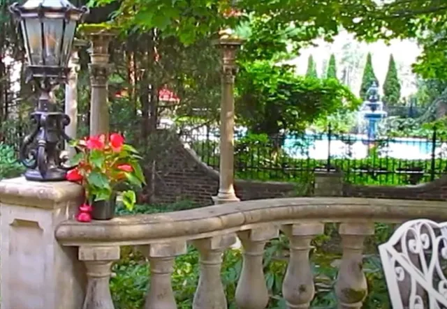 a backyard of a house with lots of green space and plants