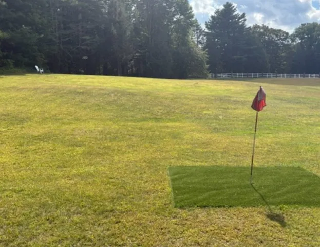 a view of yard with swimming pool and outdoor space
