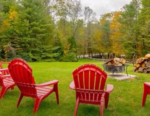 a view of a chairs in a backyard