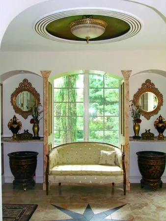 a living room with a couch and a large window