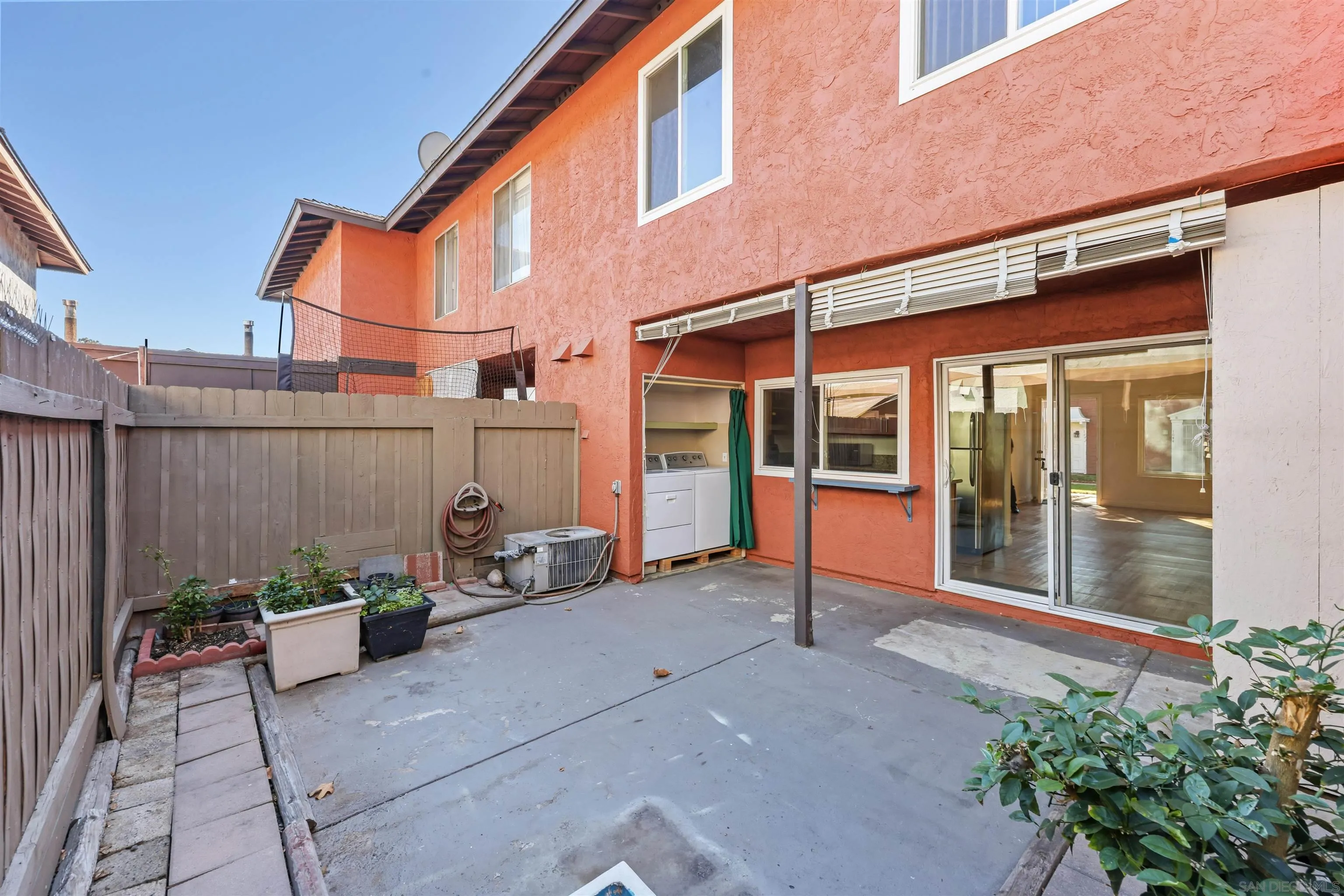 1652 Summertime Drive El Cajon, CA 92021 - Photo 14 of 23 a view of a chair and table in the back yard of the house