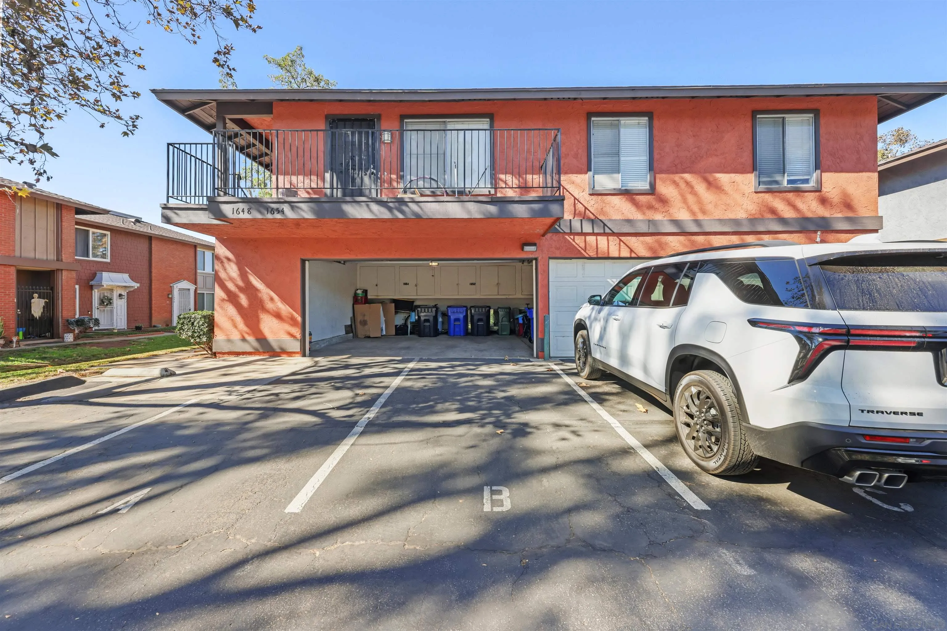 1652 Summertime Drive El Cajon, CA 92021 - Photo 15 of 23 a car parked in front of a house