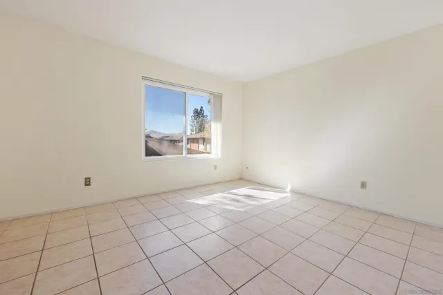 a view of an empty room and window