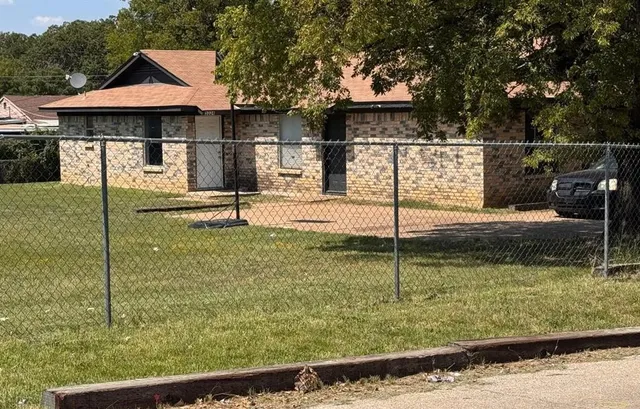 a house view with a garden space
