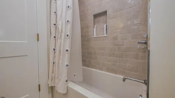 a kitchen with a sink cabinets and a window