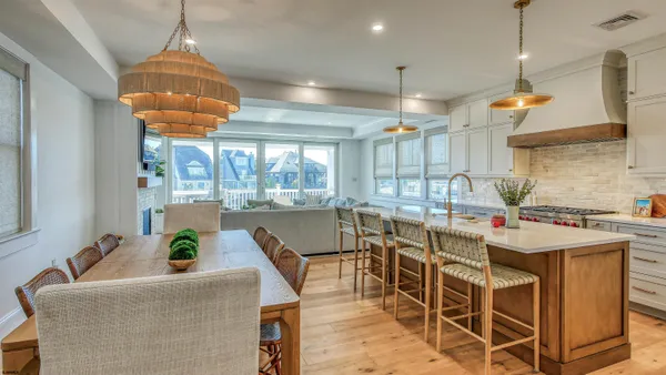 a kitchen with a table and chairs in it