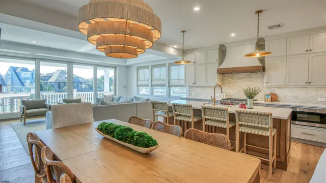 a kitchen with a table and chairs in it