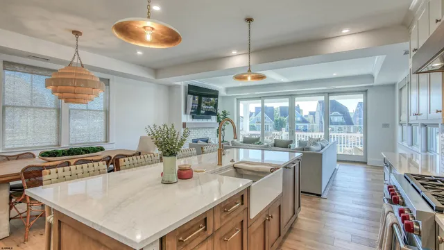 a very nice looking dining room with a large window and dining table