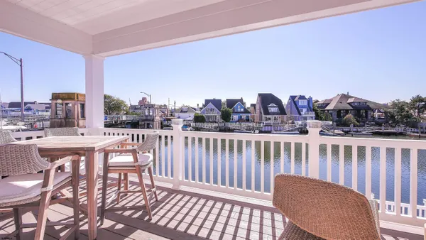 a terrace with outdoor seating and city view