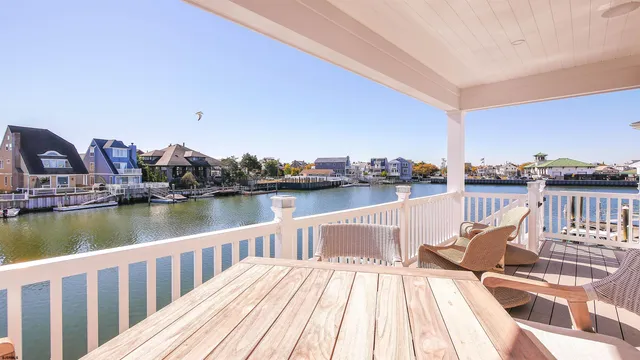 a view of a balcony with wooden floor and outdoor space