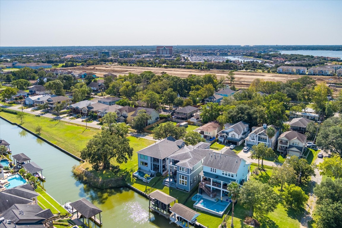 211 Valmar Street Kemah, TX 77565 - Photo 11 of 50 an aerial view of residential houses with outdoor space and swimming pool