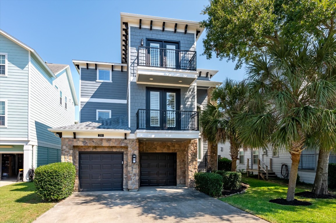 211 Valmar Street Kemah, TX 77565 - Photo 12 of 50 a front view of a house with yard and parking