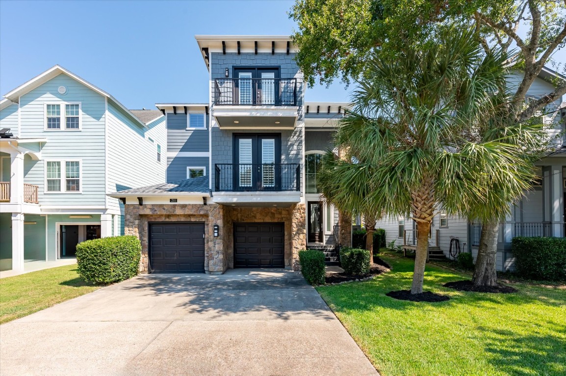 211 Valmar Street Kemah, TX 77565 - Photo 13 of 50 a front view of a house with yard and parking