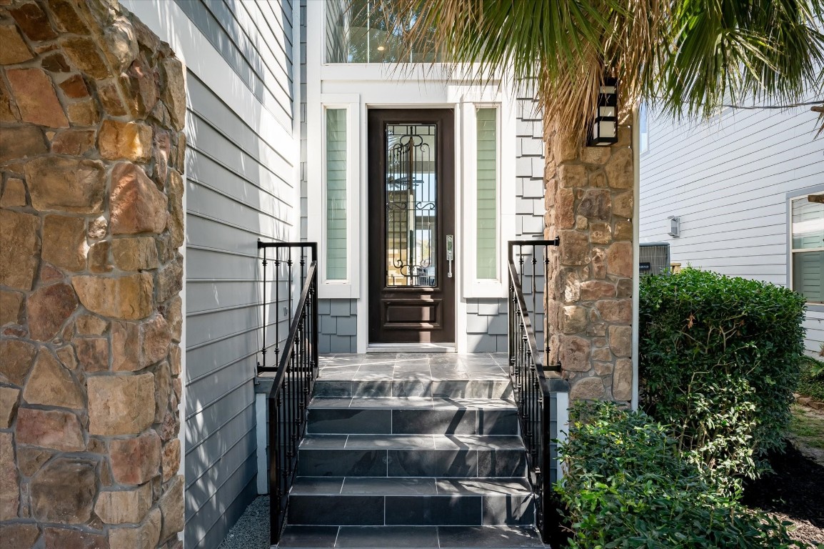 211 Valmar Street Kemah, TX 77565 - Photo 17 of 50 front view of a house with a palm tree