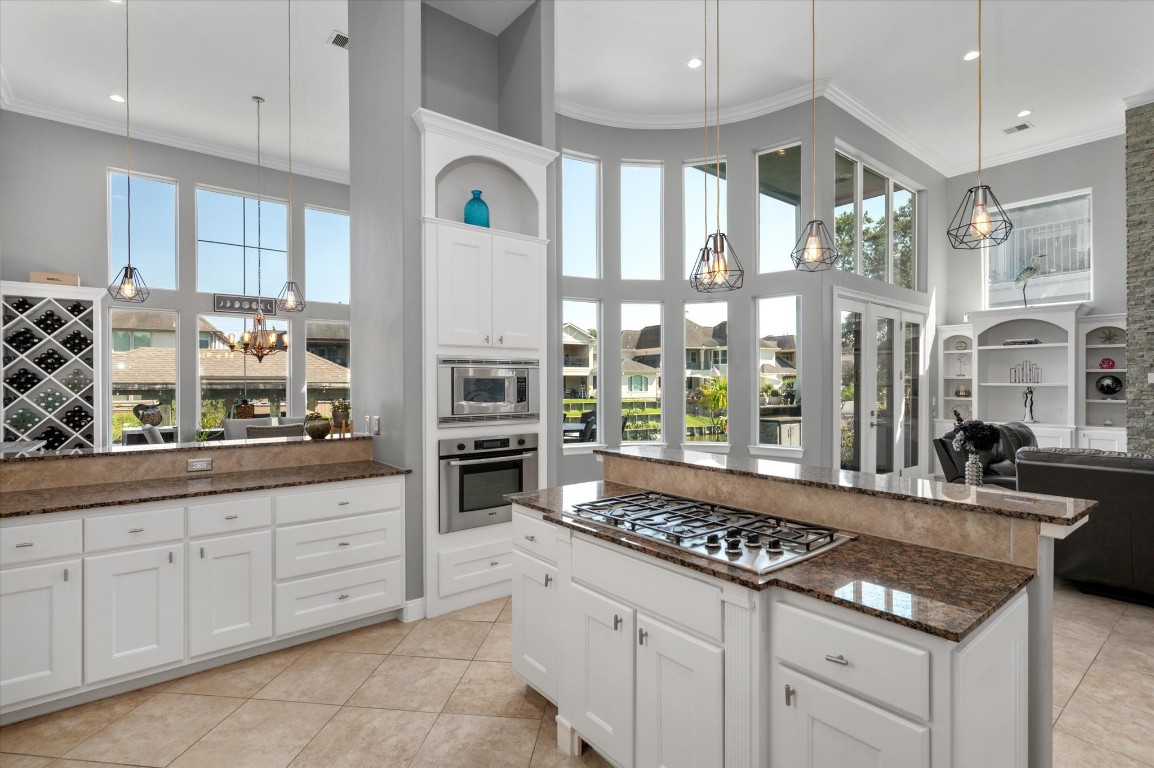211 Valmar Street Kemah, TX 77565 - Photo 29 of 50 a kitchen with counter top space cabinets and appliances
