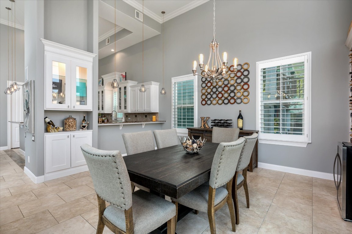 211 Valmar Street Kemah, TX 77565 - Photo 31 of 50 a view of a dining room with furniture and chandelier