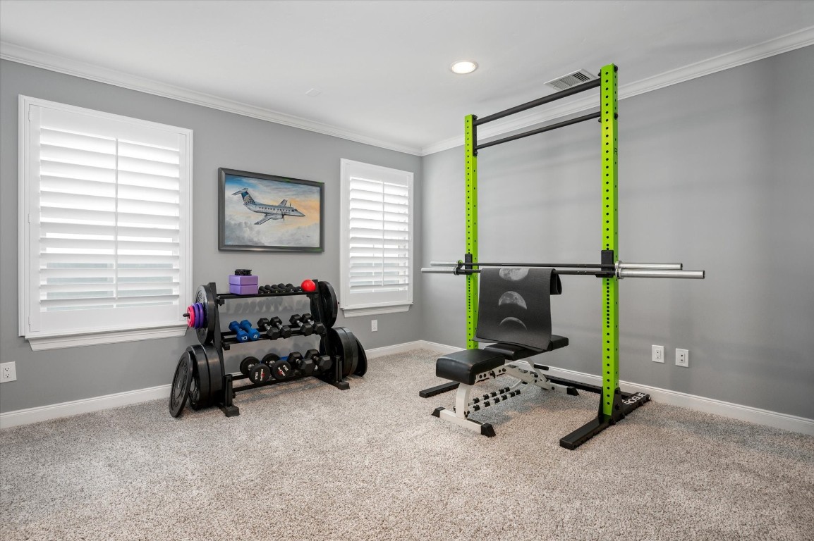211 Valmar Street Kemah, TX 77565 - Photo 35 of 50 a room with gym equipment and a flat screen tv