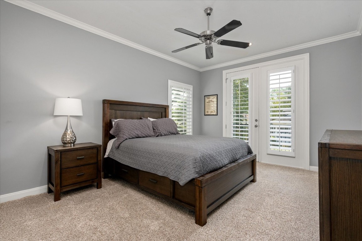 211 Valmar Street Kemah, TX 77565 - Photo 37 of 50 a bedroom with a bed chandelier and a window