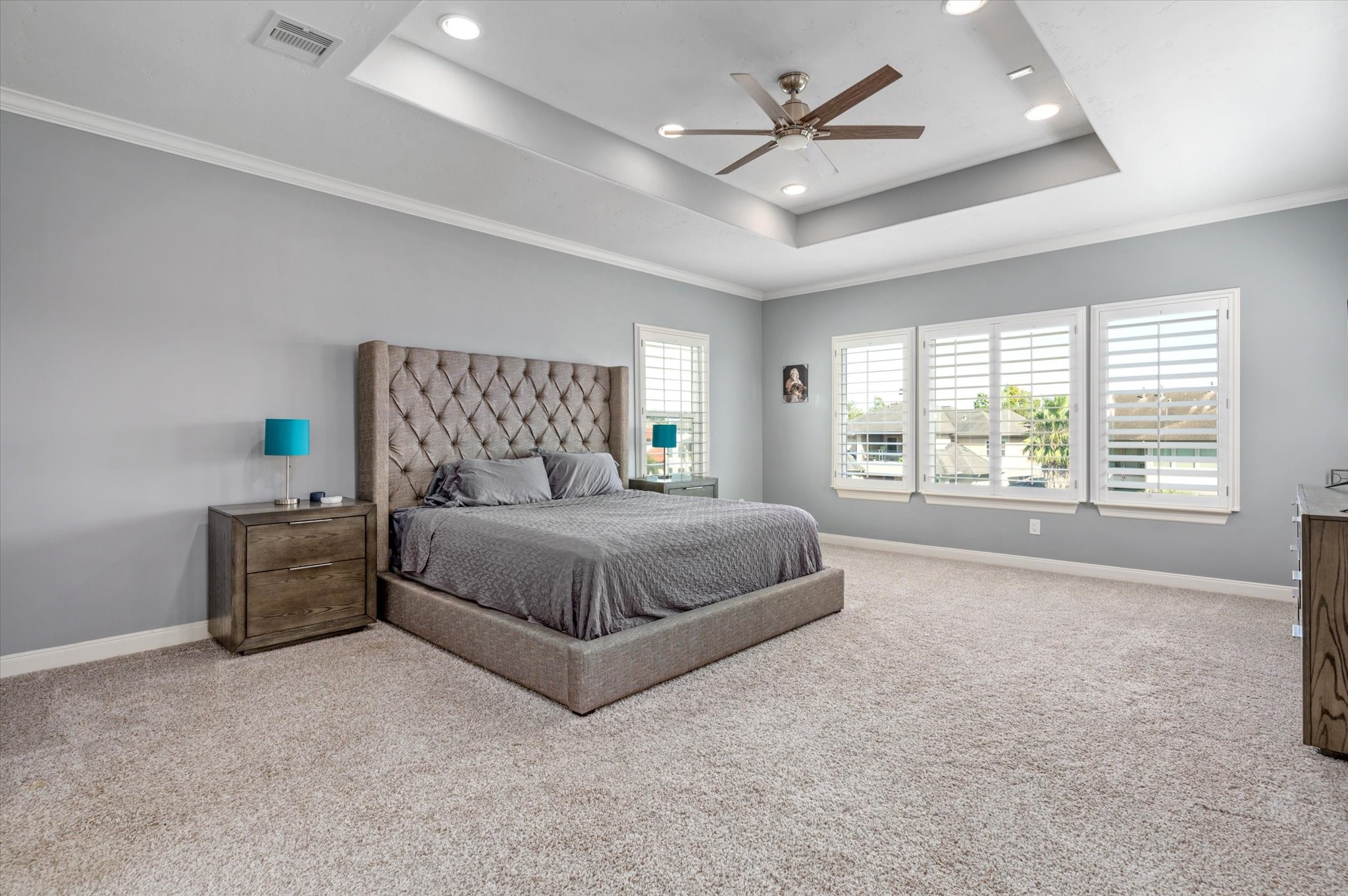 211 Valmar Street Kemah, TX 77565 - Photo 47 of 50 a bedroom with a large bed and a chandelier
