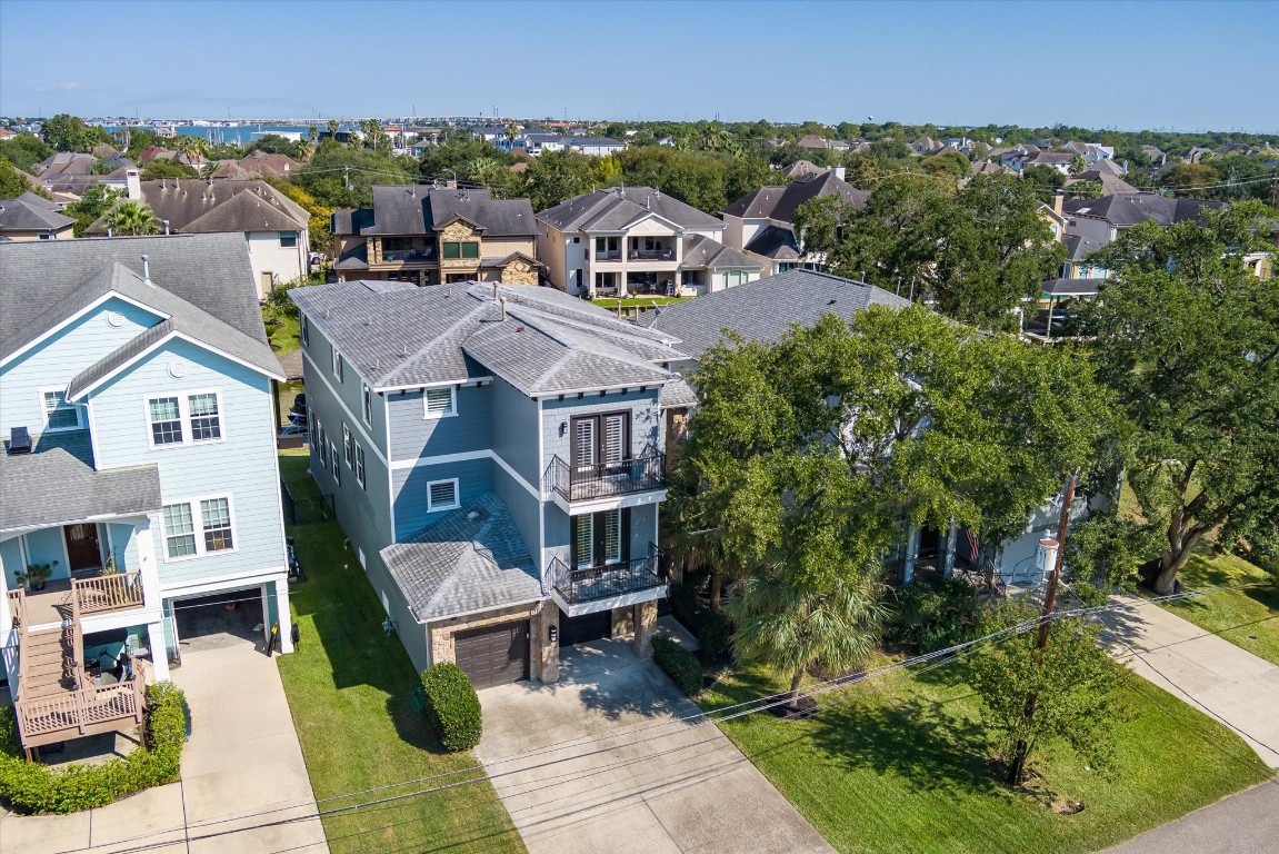 211 Valmar Street Kemah, TX 77565 - Photo 6 of 50 an aerial view of multiple houses with a yard