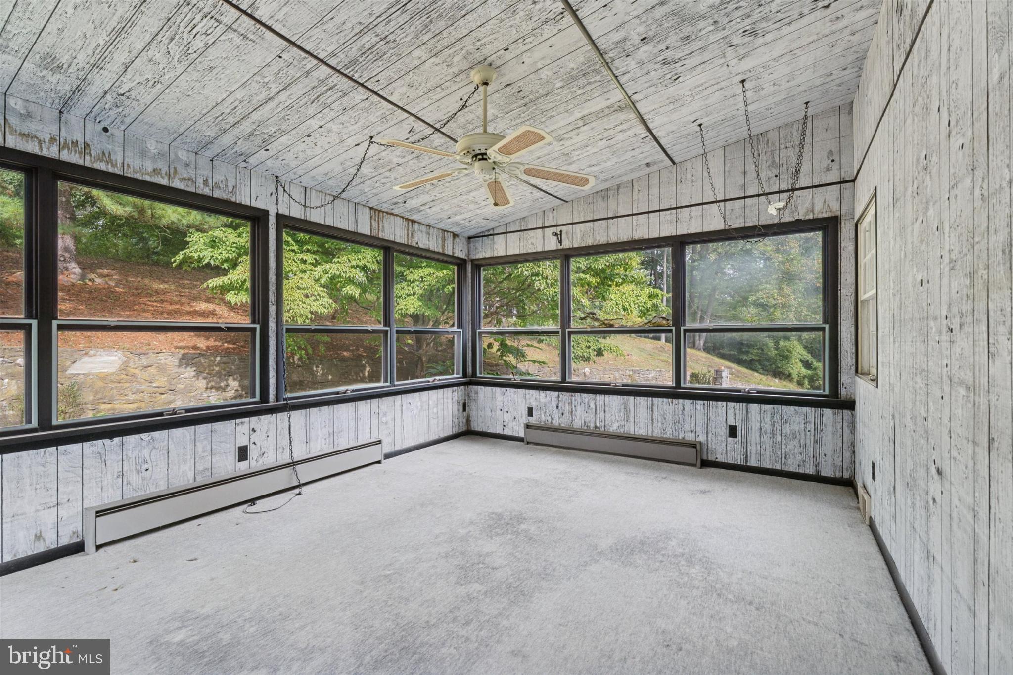 403 Atwater Road Broomall, PA 19008 - Photo 29 of 35 Bright sunroom with scenic outdoor views.