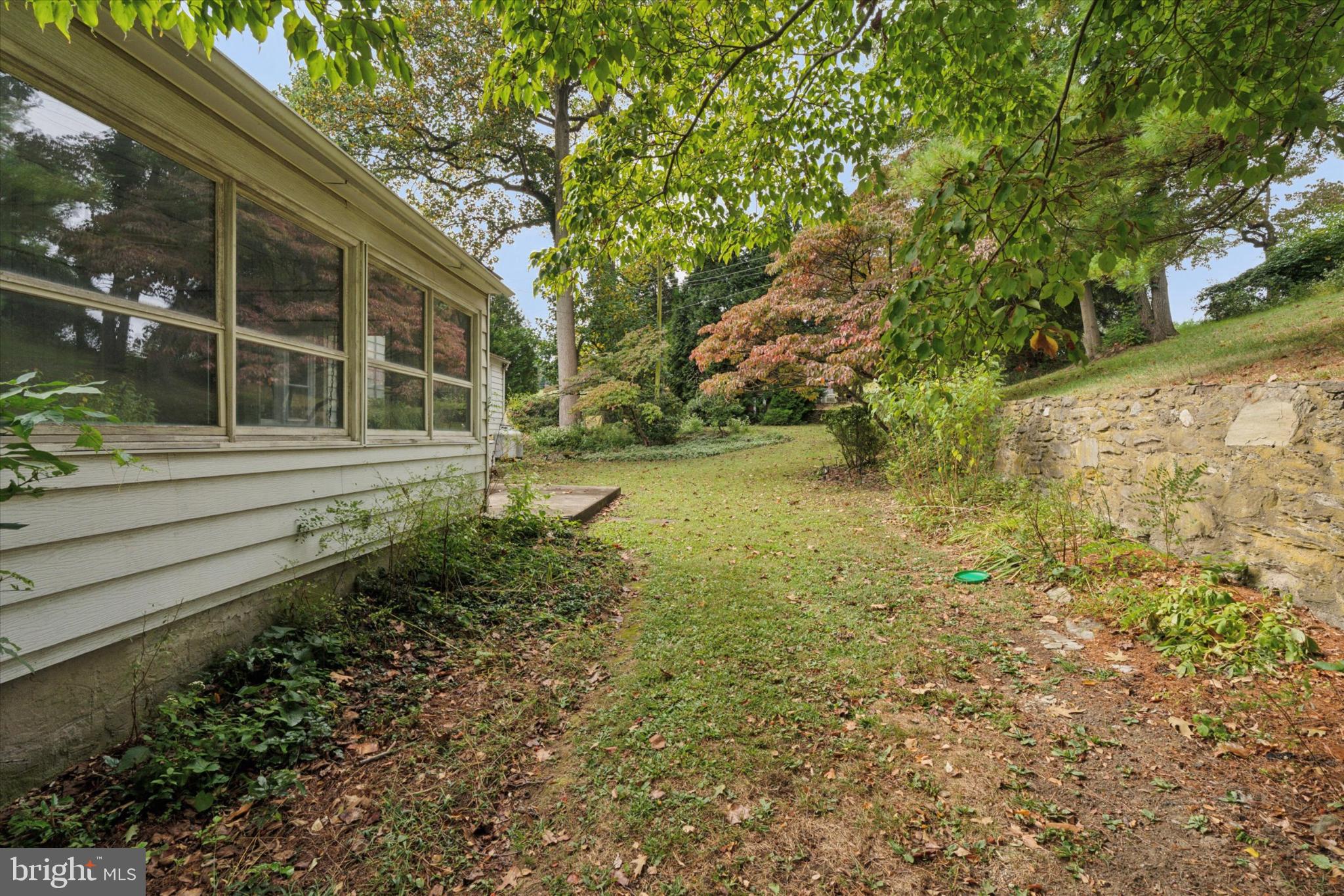 403 Atwater Road Broomall, PA 19008 - Photo 35 of 35 Serene garden retreat with lush greenery.