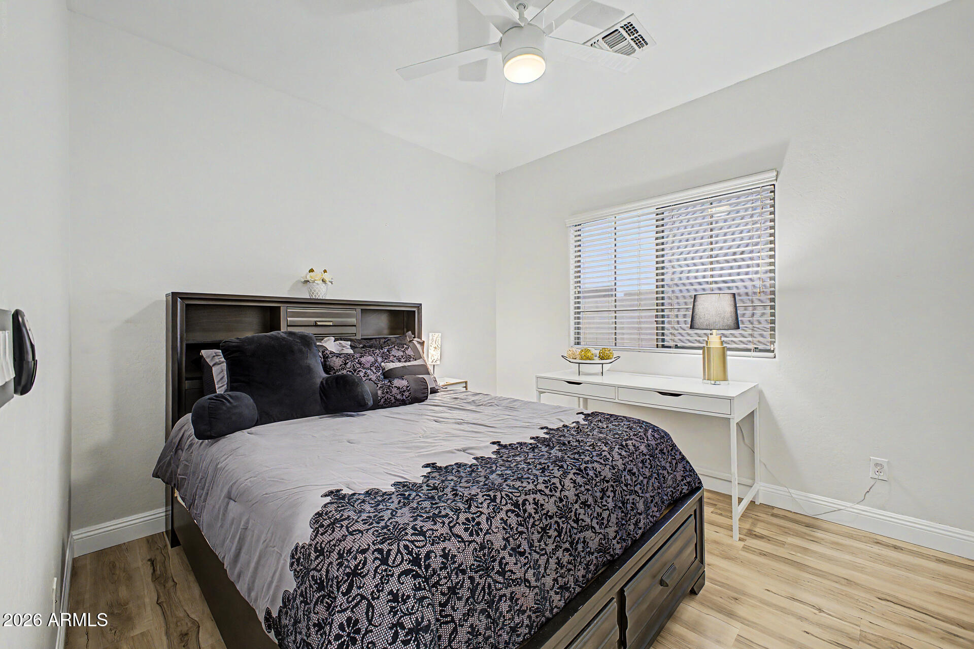 4924 West Harwell Road Laveen, AZ 85339 - Photo 18 of 27 a bedroom with a bed and window