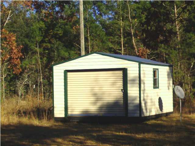 135 Henderson Road DeFuniak Springs, FL 32433 - Photo 11 of 14 a view of a house with a window