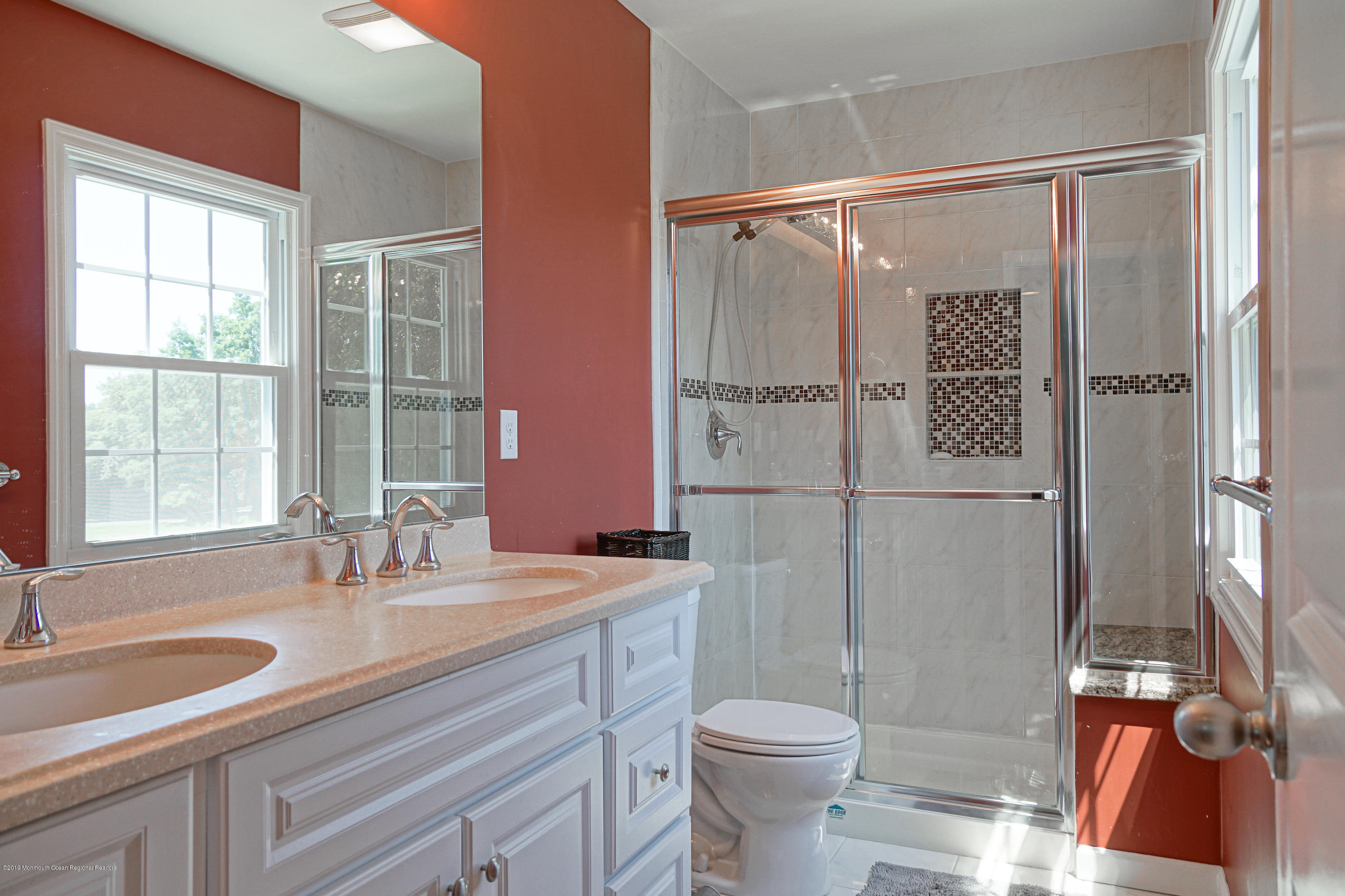 57 Ballantine Road Middletown, NJ 07748 - Photo 20 of 24 a bathroom with a double vanity sink toilet and shower