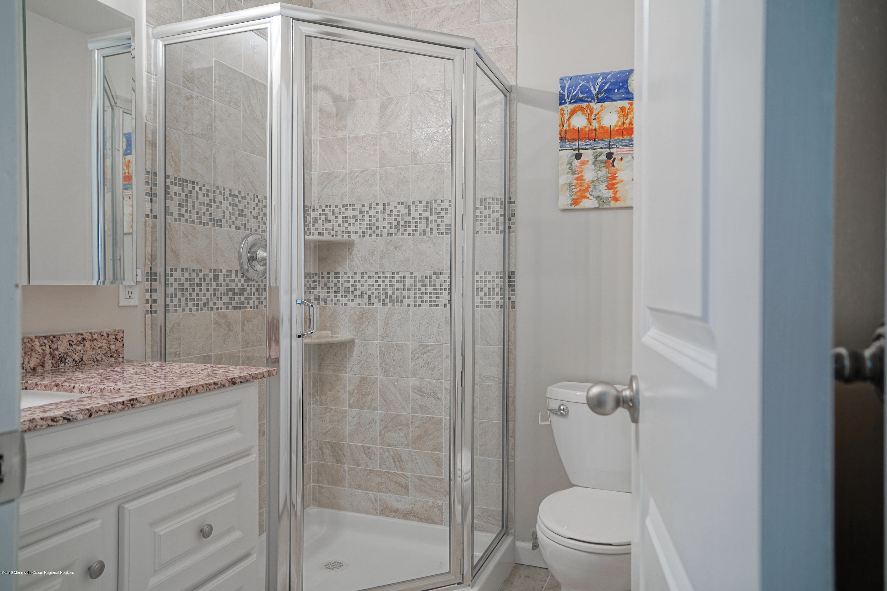 57 Ballantine Road Middletown, NJ 07748 - Photo 8 of 24 a bathroom with a granite countertop sink a toilet and shower