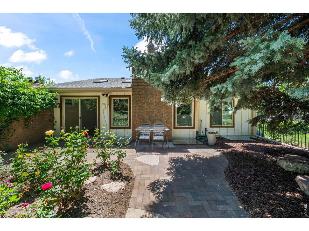 4824 Briar Ridge Court Boulder, CO 80301 - Photo 33 of 40 a front view of a house with a yard and potted plants