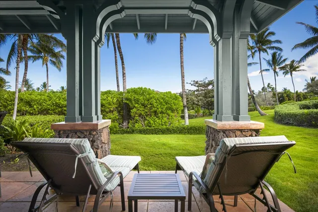 a view of a patio with table and chairs and potted plants