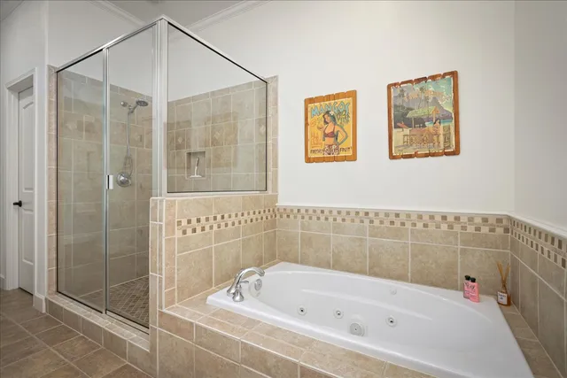 a bathroom with a bathtub and shower