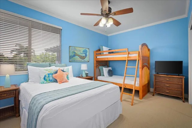 a bedroom with a bed and a tv