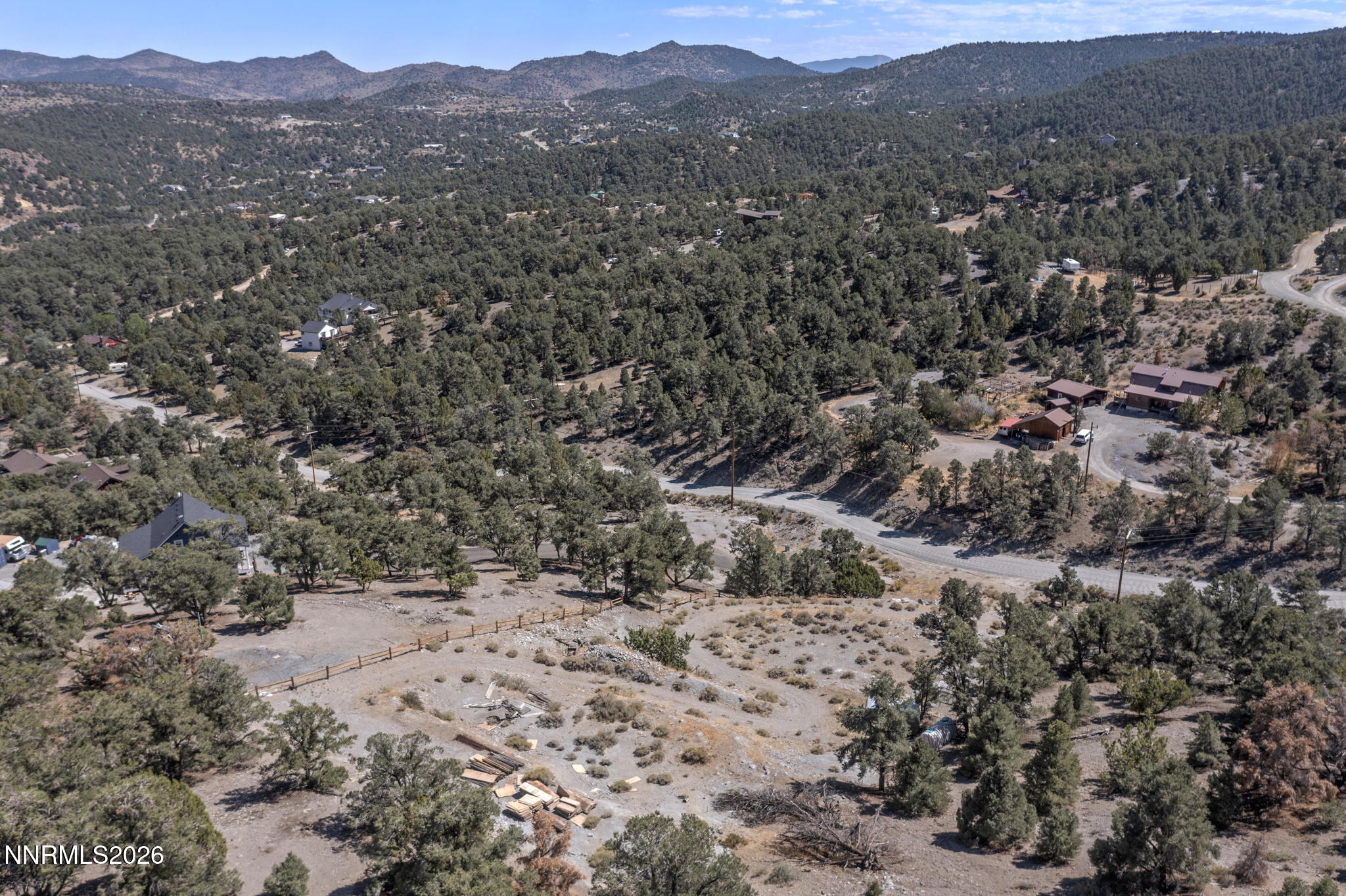 21490 Sazarac Road Reno, NV 89521 - Photo 7 of 13 a view of a forest with mountains in the background
