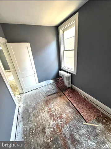 a bathroom with a tub sink and a shower