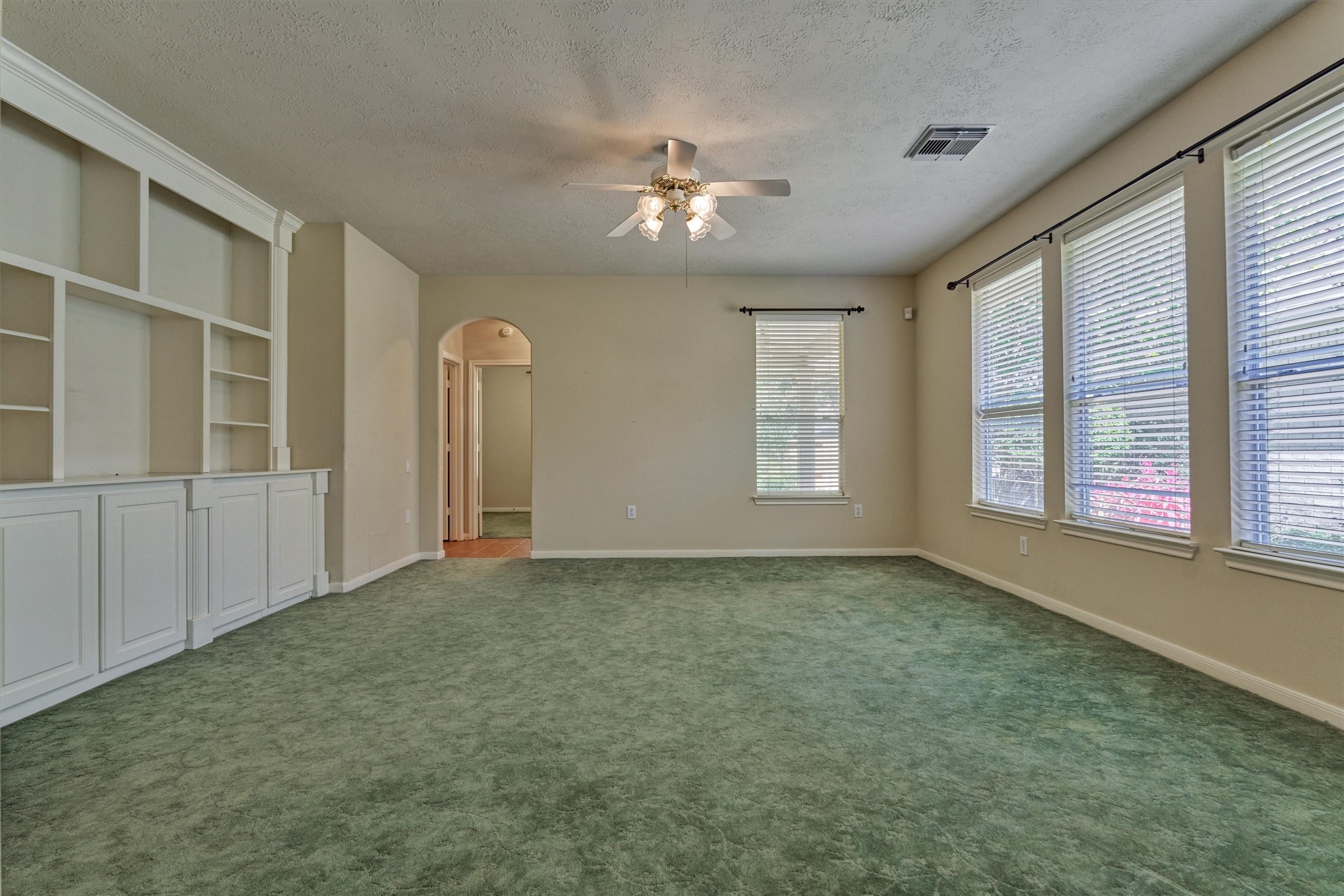 175 West Lilac Ridge Place The Woodlands, TX 77384 - Photo 14 of 31 a view of an empty room with a window