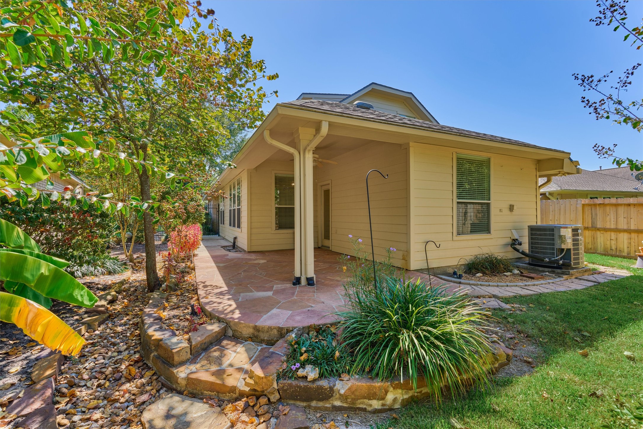 175 West Lilac Ridge Place The Woodlands, TX 77384 - Photo 5 of 31 a front view of a house with garden
