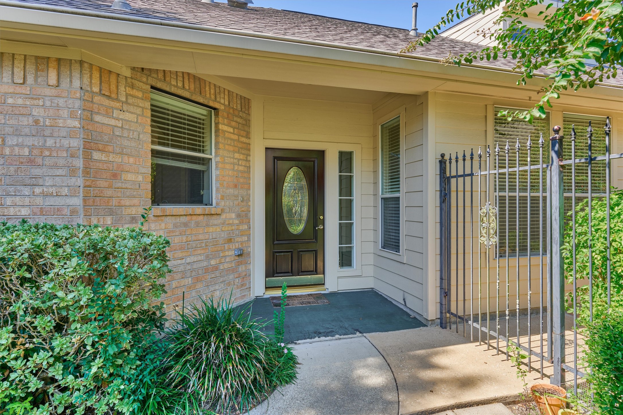 175 West Lilac Ridge Place The Woodlands, TX 77384 - Photo 7 of 31 a view of a door of the house with potted plants