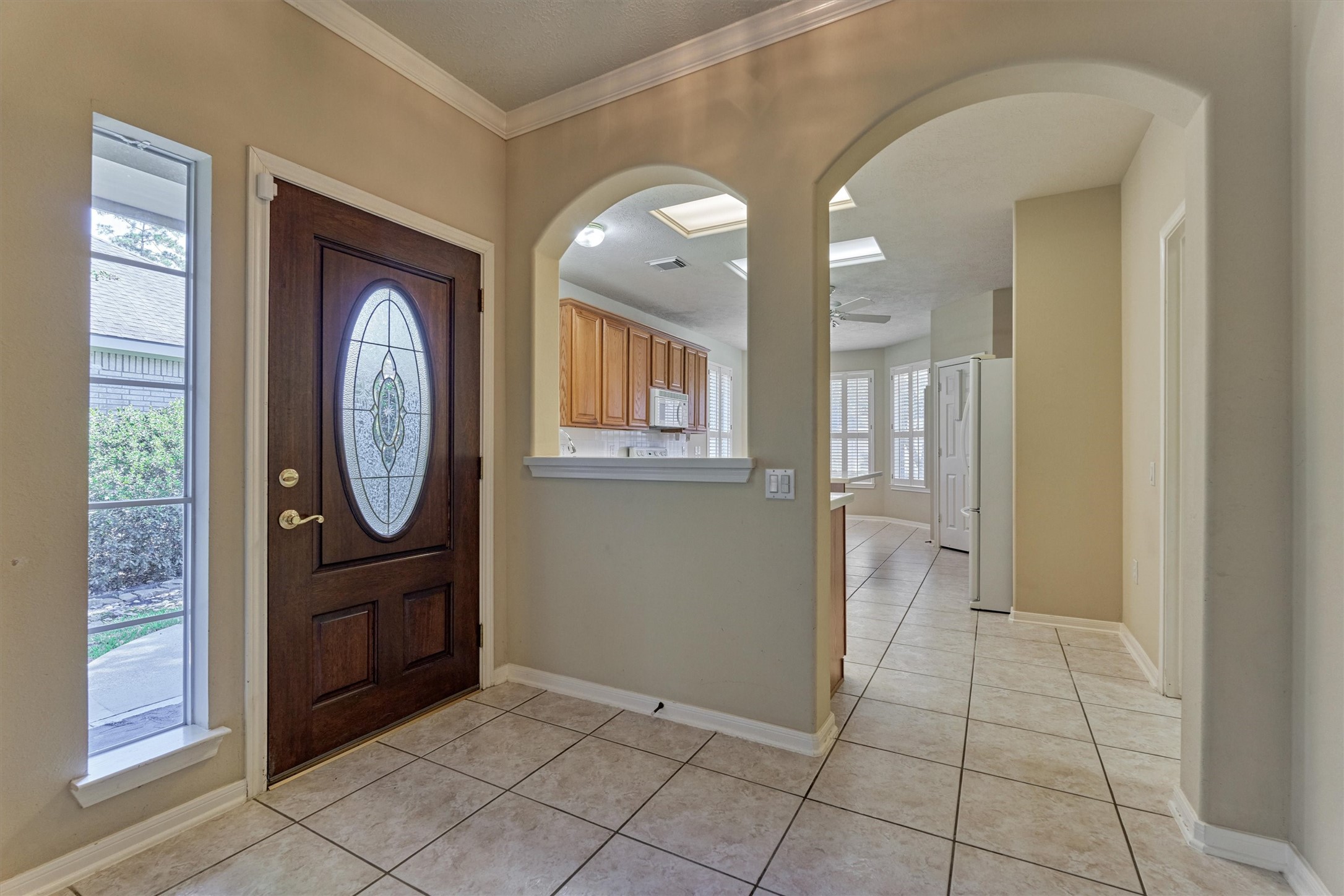 175 West Lilac Ridge Place The Woodlands, TX 77384 - Photo 8 of 31 a view of a hallway with entryway wooden floor and front door
