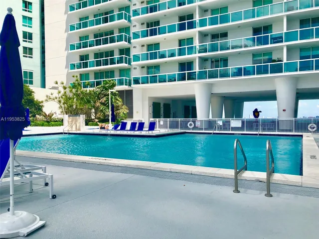 a view of swimming pool with chairs