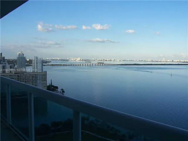 a view of an ocean with boats
