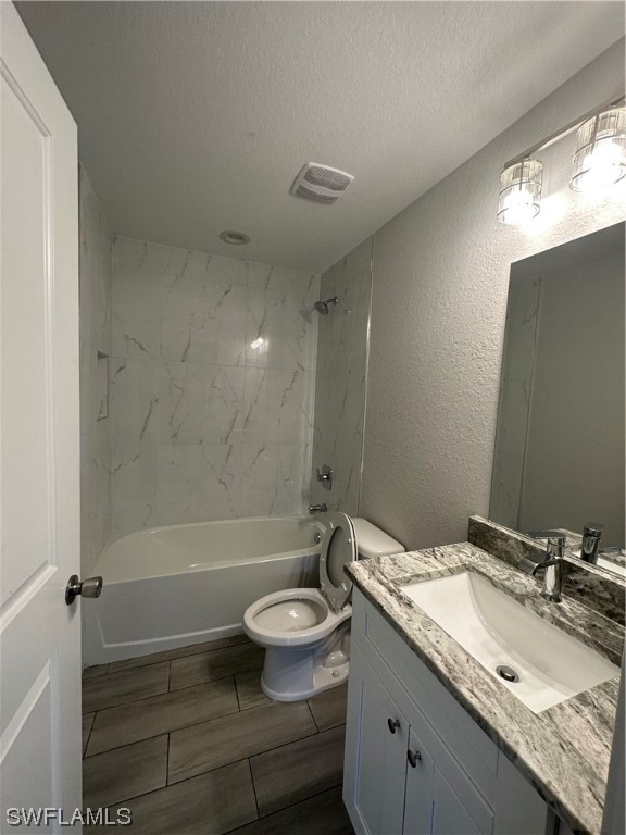 2115 Robert Avenue Alva, FL 33920 - Photo 5 of 11 a bathroom with a granite countertop sink toilet and shower