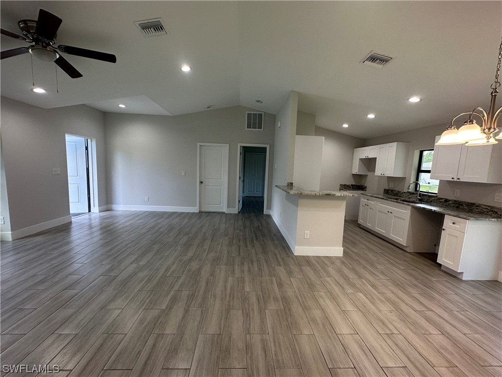 2115 Robert Avenue Alva, FL 33920 - Photo 7 of 11 a view of kitchen with sink and refrigerator