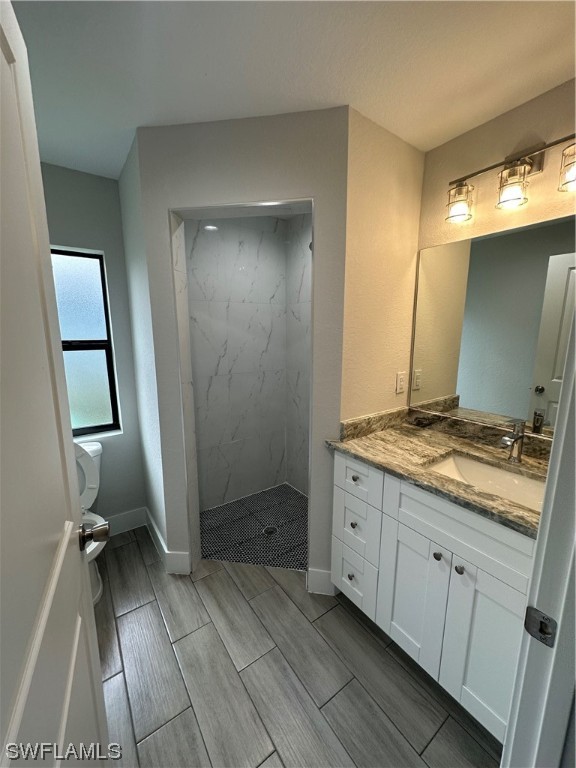 2115 Robert Avenue Alva, FL 33920 - Photo 9 of 11 a bathroom with a granite countertop sink a toilet and a mirror