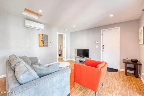 a living room with furniture and a large window